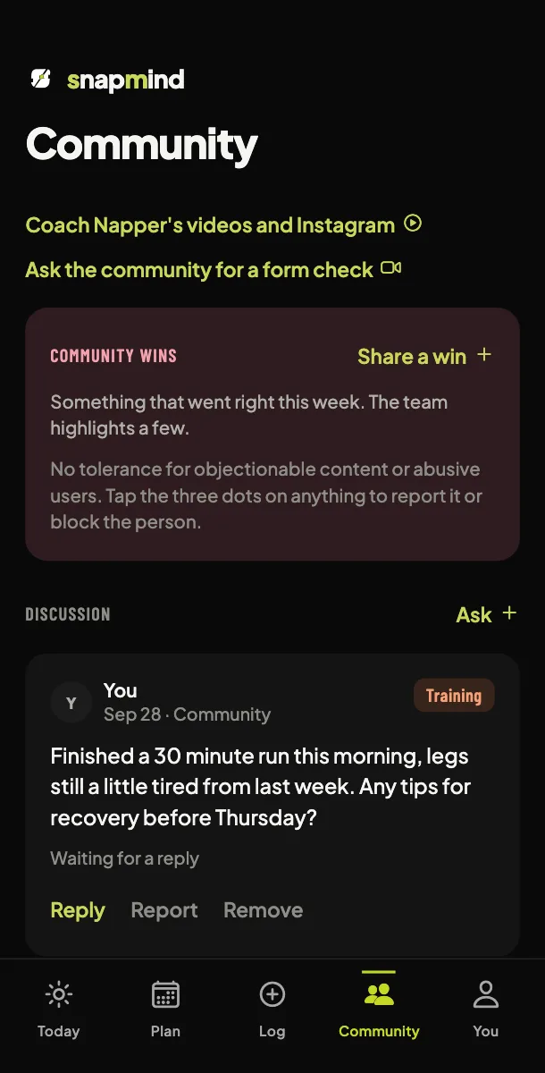 The Community screen: your trainer's videos and Instagram, community wins and a discussion where members ask questions